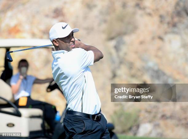 Professional basketball player Gerald Henderson Jr. Hits an approach shot from the fairway during the Coach Woodson Las Vegas Invitational at Cascata...