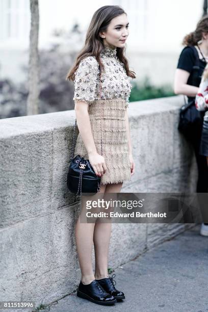 Rowan Blanchard wears a lace mesh dress with tweed, outside the launch party for Chanel's new perfume 'Gabrielle', during Paris Fashion Week - Haute...