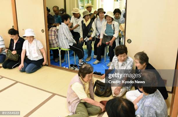Residents in Saijo, Ehime Prefecture, in southwestern Japan take part in an evacuation drill on July 10 in the wake of North Korea's repeated...