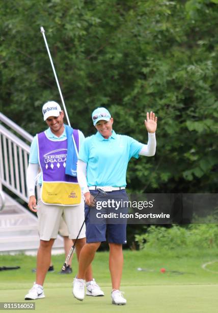 Katherine Kirk of Australia acknowledges and waves toward the crowd after sinking a putt on hole number eighteen, winning the Thornberry Creek LPGA...