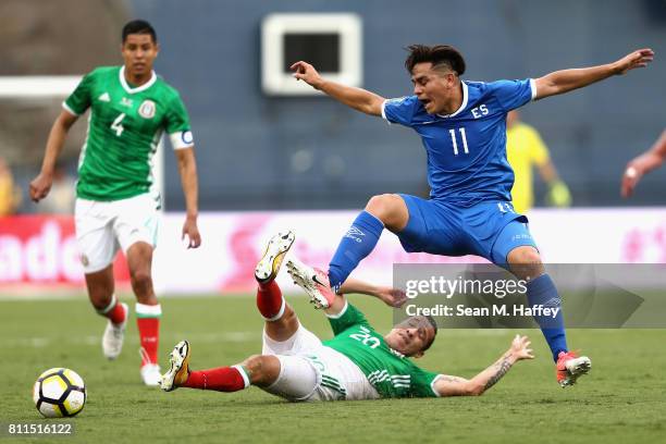 Hugo Ayala and Jesus Duenas of Mexico defend against Rodolfo Zelaya of El Salvador during the first half of a 2017 CONCACAF Gold Cup Group C match at...