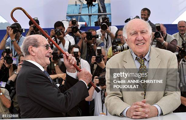 Portuguese director Manoel de Oliveira jokes with French actor Michel Piccoli during a photocall at the 61st Cannes International Film Festival on...