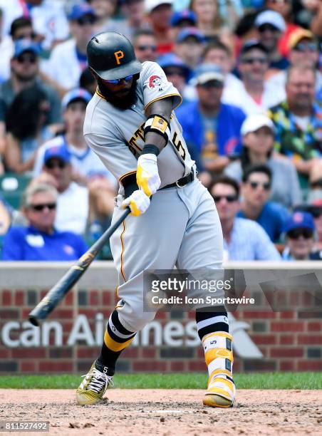 Pittsburgh Pirates left fielder Josh Harrison hits the ball for a single during the game between the Pittsburg Pirates and the Chicago Cubs on July...