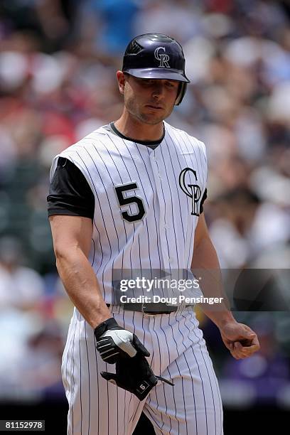 Matt Holliday of the Colorado Rockies reacts after being hit in the hand by a pitch from Kevin Slowey of the Minnesota Twins in the first inning...