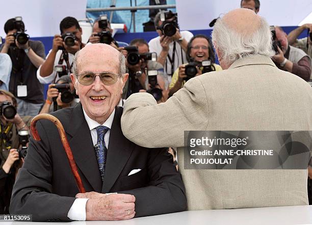 Portuguese director Manoel de Oliveira poses with French actor Michel Piccoli during a photocall at the 61st Cannes International Film Festival on...
