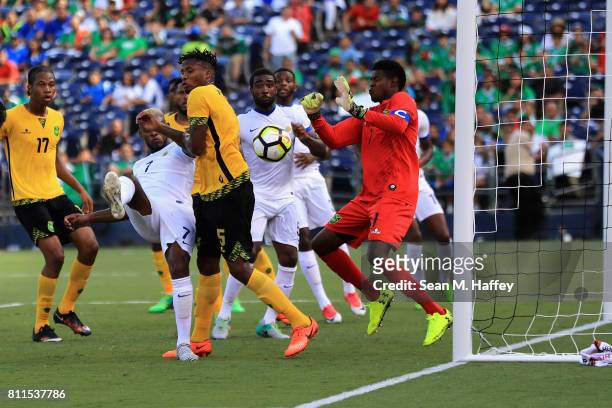 Leandro Bacuna of Curacao takes a shot on goal as Alvas Powell and Andre Blake of Jamaica defend during the second half of a 2017 CONCACAF Gold Cup...