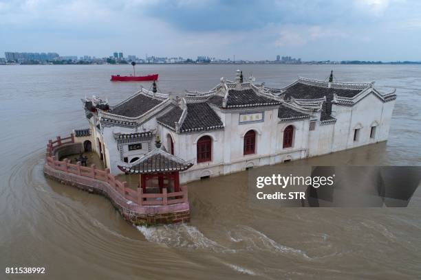 This picture taken on July 7, 2017 shows the Guanyin Pavilion immersed in floodwaters in Ezhou, Hubei province. - Severe rainfall in central China's...