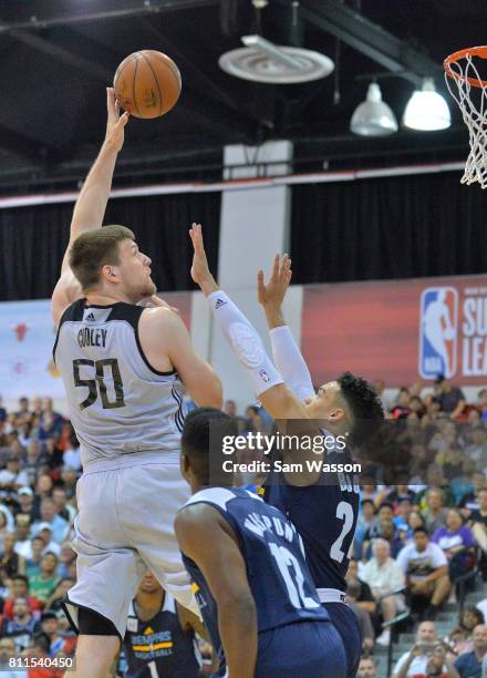 Jack Cooley of the Sacramento Kings shoots against Wes Washpun and Dillon Brooks of the Memphis Grizzlies during the 2017 NBA Summer League game at...