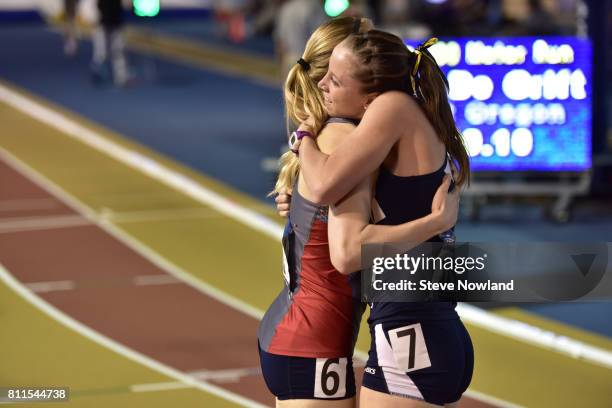 Kailey Fuchs of Central Missouri, left, embraces Carsyn Koch of Cedarville following the 800 meter run during the Division II Men's and Women's...