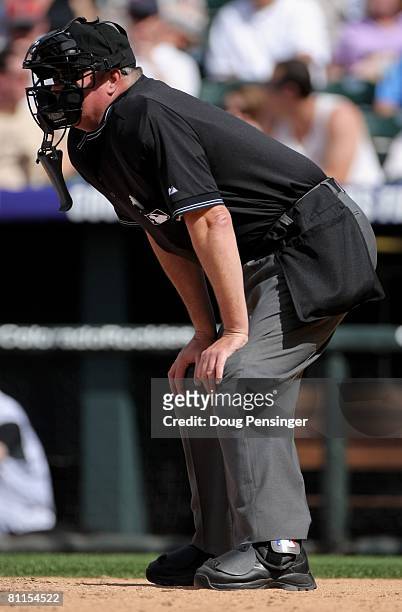 Homeplate umpire and crew chief Tim Welke oversees the action between the Minnesota Twins and the Colorado Rockies during Interleague MLB action at...