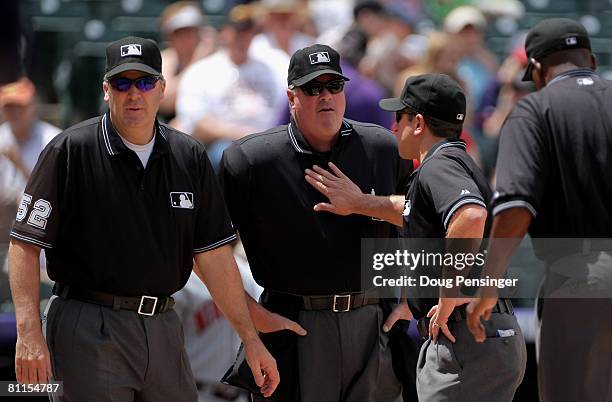 The umpiring crew of Bill Welke, crew chief Tim Welke, Chris Guccione and Chuck Meriwether prepare for action between the Minnesota Twins and the...