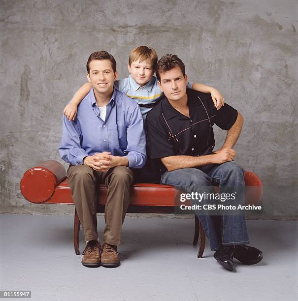 Promotional portrait of, from left, American actors Jon Cryer, Angus T. Jones, and Charlie Sheen for the television comedy 'Two and a Half Men,' Los...