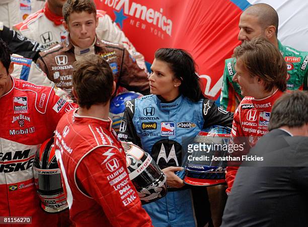 Indy 500 driver Danica Patrick prepares to pose with the rest of the field at the "Charging Bull" statue in Bowling Green Park during a media...