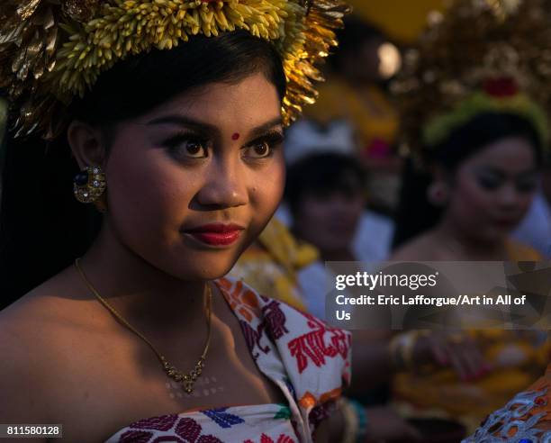 Teenage girl in traditional costume before a tooth filing ceremony, Bali island, Canggu, Indonesia on July 22, 2015 in Canggu, Indonesia.