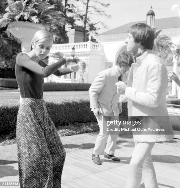 Twiggy is the guest of honor at a party held at the house of Sonny and Cher, L-R: Twiggy, Justin de Villeneuve , and Sonny Bono on May 15, 1967 in...