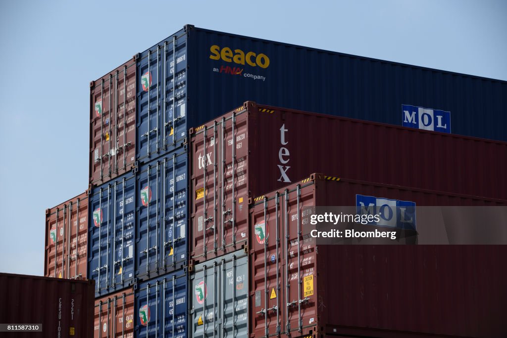 Japanese Container Line Containers sit stacked at a shipping terminal in Tokyo, Japan, on ...