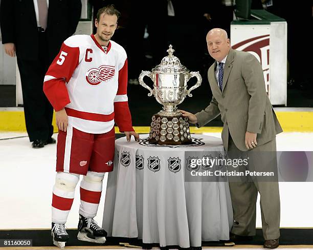 Nicklas Lidstrom of the Detroit Red Wings poses with the Clarence S. Campbell Bowl and NHL Deputy Commissioner Bill Daly after defeating the Dallas...