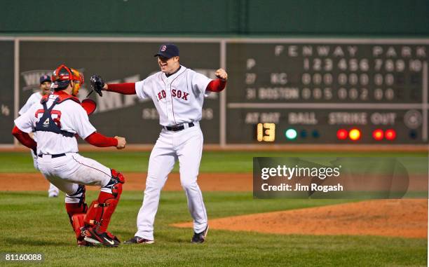 Jon Lester of the Boston Red Sox reacts with teammate Jason Varitek after throwing a no hitter against the Kansas City Royals at Fenway Park on May...