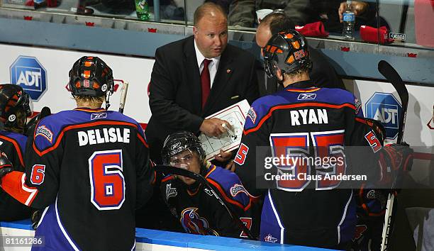 Head coach Benoit Groulx gives some instructions to his Gatineau Olympiques during a stoppage in play against the Belleville Bulls in the 4th game of...