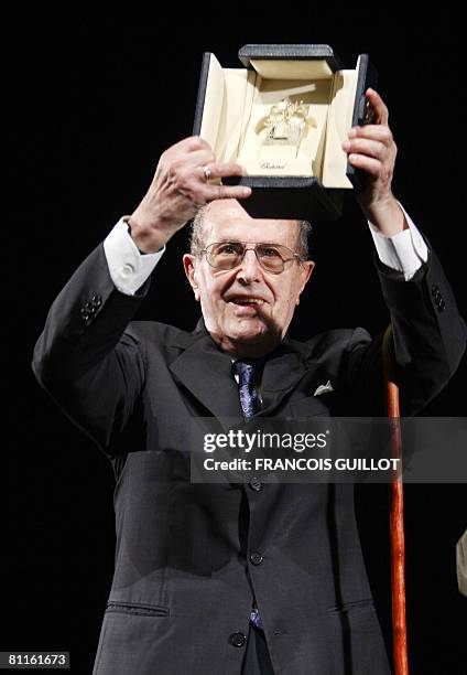 Portuguese director Manoel de Oliveira holds his Palme d?or for his life achievement during a ceremony in his honour at the 61st Cannes International...