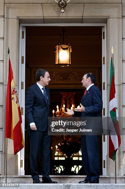 Spain's Prime Minister Jose Luis Rodriguez Zapatero chats with Basque premier Juan Jose Ibarretxe upon his arrival at La Moncloa Palace on May 20,...