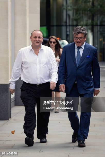 Mike Ashley, billionaire and founder of Sports Direct International Plc, left, arrives at court with Keith Bishop, founder of Keith Bishop...