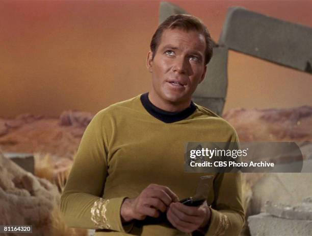 Canadian actor William Shatner glances upwards in a scene from an episode of the television series 'Star Trek' entitled 'The Man Trap,' 1966. The...