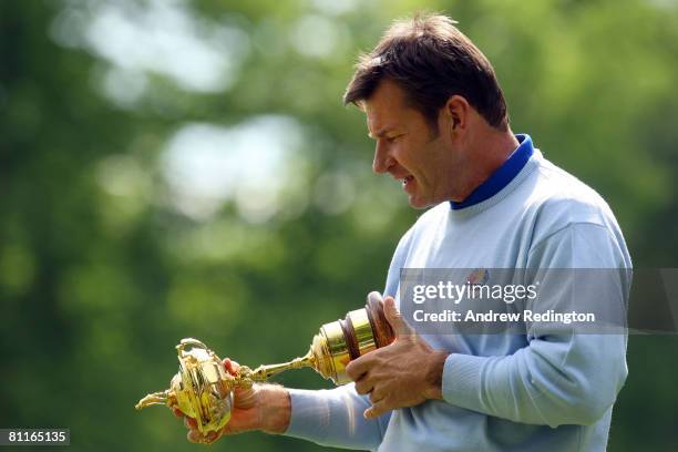 European Ryder Cup captain Nick Faldo poses with the Trophy during the Ryder Cup Press Conference at the BMW Championship at The Wentworth Club on...
