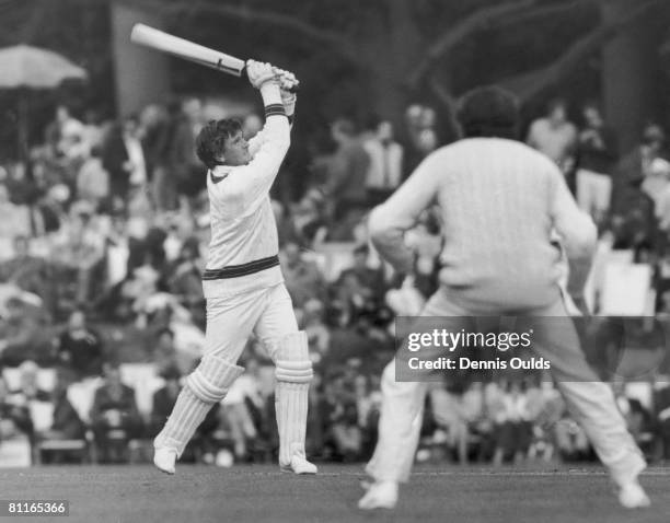 Australian cricketer Keith Stackpole hits out at a ball from Geoff Arnold during a match against the Duke of Norfolk's XI at Arundel, 22nd April 1972.