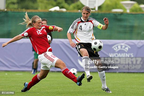 Stina Mikkelsen of Denmark battles for the ball with Valeria Kleiner of Germany during the European Women's U17 Championship match between Germany...