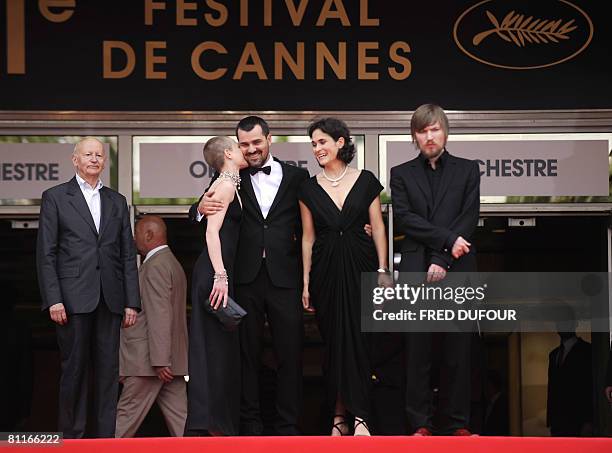 Hungarian actress Orsi Toth kisses director Kornel Mindruczo as they pose with actors Lili Monori and Felix Lajko prior to the screening of Hungarian...