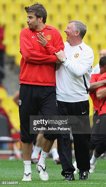 Sir Alex Ferguson and Gerard Pique of Manchester United in action during a training session ahead of the UEFA Champions League Final at Luzhniki...