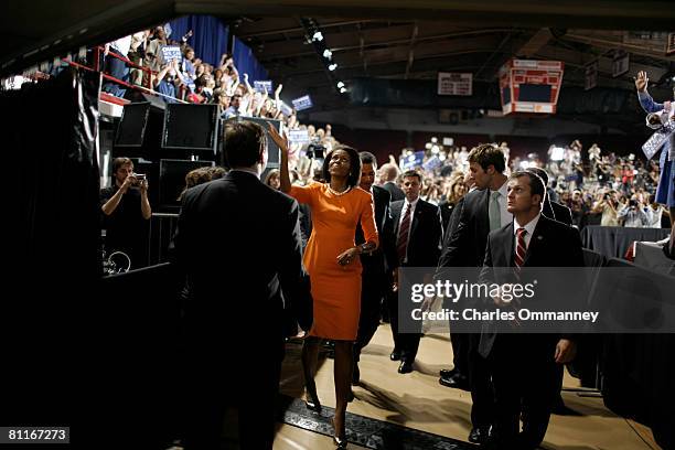 Democratic presidential hopeful Sen. Barack Obama and his wife Michelle Obama greet the crowd after speaking during a rally at the North Carolina...