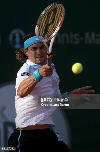 David Ferrer of Spain plays aforehand during his match against Mikhail Youzhny of Russia during day three of the ARAG World Team Cup at the...