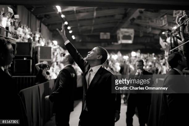 Democratic presidential hopeful Sen. Barack Obama and his wife Michelle Obama greet the crowd after speaking during a rally at the North Carolina...