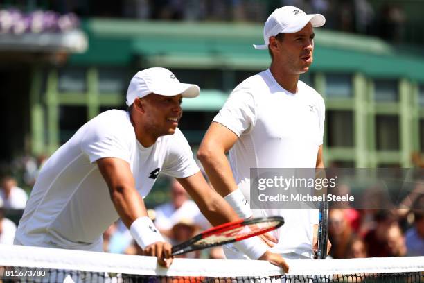 Jay Clarke of Great Britain and Marcus Willis of Great Britain look on during the Gentlemen's Doubles third round match against Oliver Marach of...