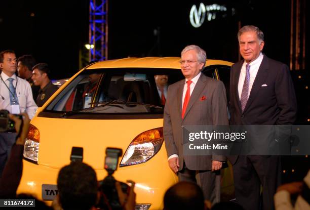 Ratan Tata, Chairman of Tata Motors and Tata Sons with Ravi Kanth, Managing Director of Tata Motors, posing with newly launched Tata Nano in Mumbai.