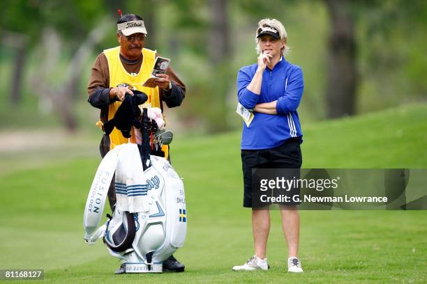 Eva Dahllof of Sweden stands with her caddie during the first round of the SemGroup Championship presented by John Q. Hammons on May 1, 2008 at Cedar...