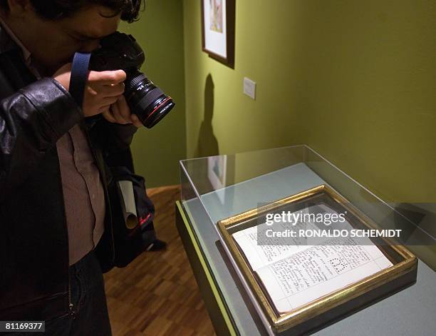 Photographer takes a pictures of a manuscript by Spanish painter Remedios Varo on display at the Museum of Contemporary Art in Mexico City, on 20...