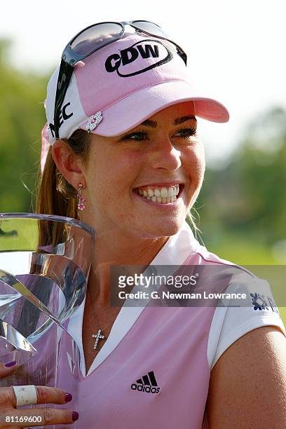 Paula Creamer holds the trophy after defeating Juli Inkster in a playoff of the SemGroup Championship presented by John Q. Hammons on May 4, 2008 at...