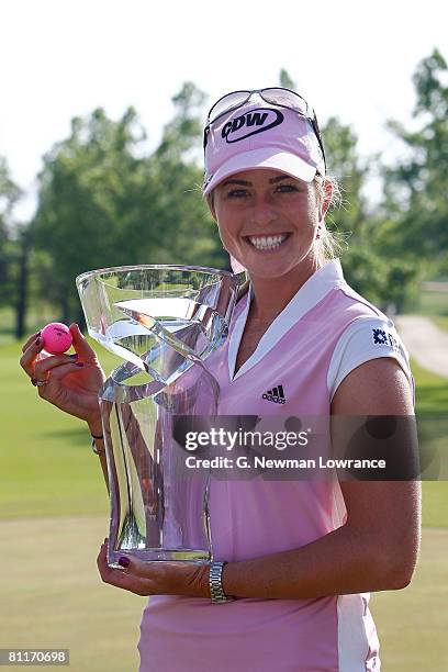 Paula Creamer holds the trophy after defeating Juli Inkster in a playoff at the SemGroup Championship presented by John Q. Hammons on May 4, 2008 at...