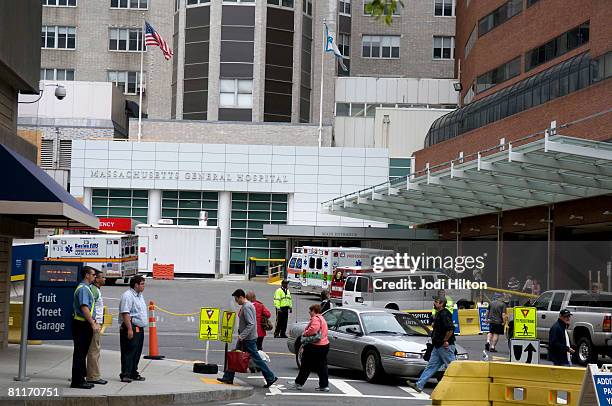 People walk outside Massachusetts General Hospital where US Sen. Edward Kennedy is being treated May 20, 2008 in Boston, Massachusetts. After being...