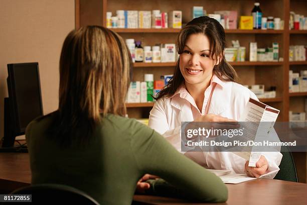 pharmacist with patient - design pics don hammond stock pictures, royalty-free photos & images