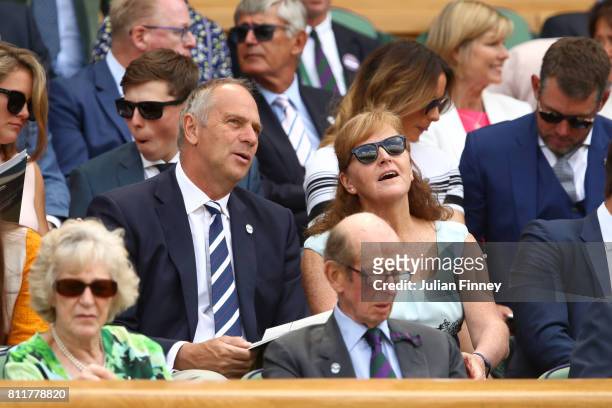 Sir Steve Redgrave and Lady Ann Redgrave look on from the centre court royal box on day seven of the Wimbledon Lawn Tennis Championships at the All...