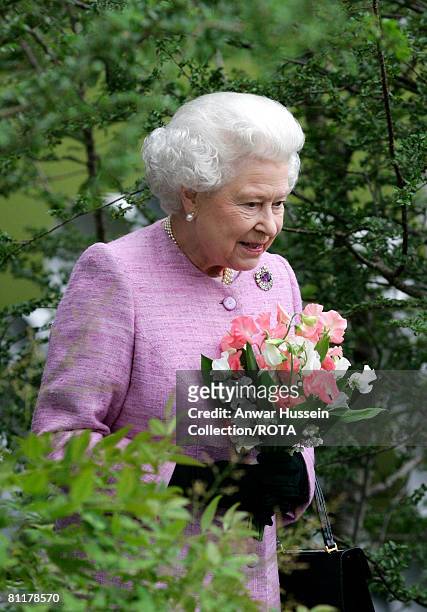 Queen Elizabeth ll looks at a show garden at the Chelsea Flower Show on May 19, 2008 in London, England.
