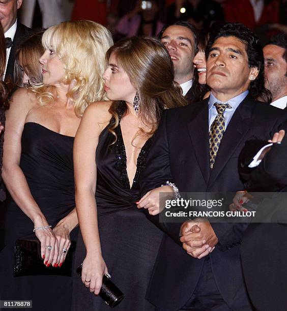 Former Argentinian football player Diego Maradona (R arrives with his wife Claudia and daughter Dalma to attend the screening of Serbian director...