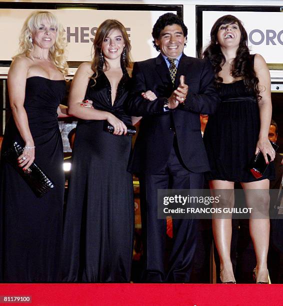 Former Argentinian football player Diego Maradona poses with his wife Claudia and daughters Dalma and Giannina as he arrives to attend the screening...