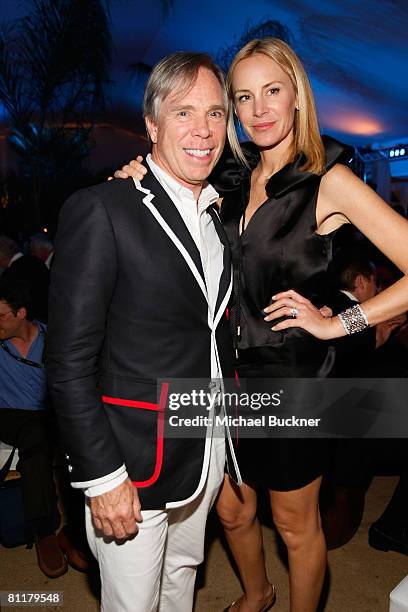 Designer Tommy Hilfiger and Dee Ocleppo attend the Roman Polanski "Wanted and Desired" after party at Nikki Beach during the 61st Cannes...