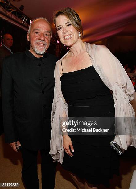 Writer Paulo Coelho and director Marina Zenovich attend the Roman Polanski "Wanted and Desired" after party at Nikki Beach during the 61st Cannes...