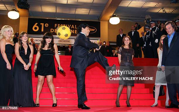 Former Argentinian football player Diego Maradona dribbles with a ball surrounded by his wife of Claudia, daughters Dalma and Giannina, Serbian...